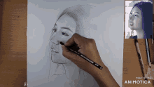 a person is drawing a woman 's face with a pencil that says made in animotica