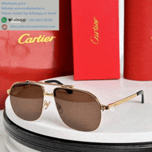 a pair of cartier sunglasses sitting on top of a table