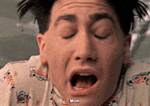 a close up of a man 's face with his mouth open and the words mom visible