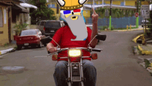 a man riding a honda motorcycle with a cartoon character on his head