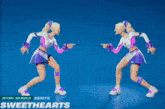 two cheerleaders are dancing in front of a blue background with the words sweethearts on the bottom
