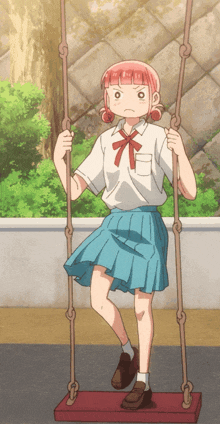 a girl in a blue skirt is sitting on a swing