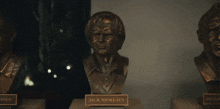 two busts of tiger woods and jack nicklaus on display