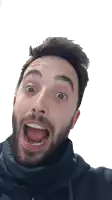 a man with a beard is making a surprised face with his mouth open