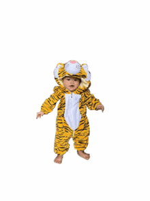 three babies dressed up in tiger costumes are standing next to each other