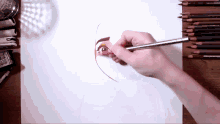 a person is drawing a woman 's face with a pencil