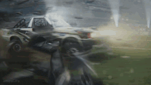a man is riding a motorcycle next to a car that is going through a tornado