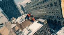 a man in a superhero costume is flying through the air