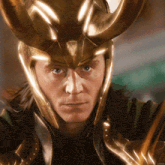 a close up of a man wearing a helmet with horns and the words chrisc on the bottom
