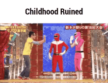 a man in a yellow shirt is giving a high five to a man in a red superhero costume ..