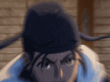 a blurry picture of a man wearing a hat