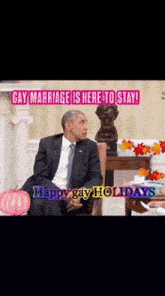 a man in a suit and tie is sitting in front of a fireplace with the words gay marriage is here to stay written above him