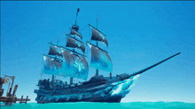 a pirate ship with blue sails is in the ocean