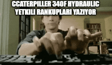 a man is typing on a keyboard in a living room while making a funny face .
