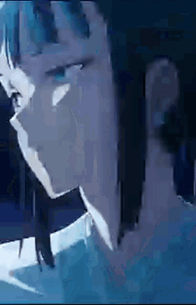 a close up of a person 's face with blue eyes