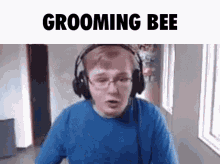 a man wearing headphones says grooming bee on the bottom