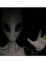 a close up of an alien 's face with a pink background