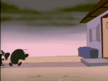 a silhouette of a cartoon character standing in front of a building