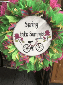 a wreath that says spring into summer on it