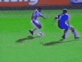 a soccer game is being played in front of an advertisement for go