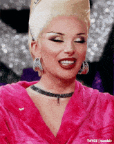 a close up of a woman wearing a pink robe and earrings with tumblr written on the bottom