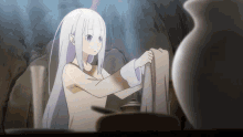 a girl with long white hair is standing next to a vase
