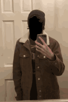 a person taking a selfie in front of a mirror