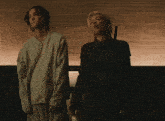 a man and a woman standing next to each other