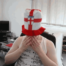 a person wearing a red white and blue hat that says england