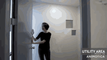 a woman is standing in a hallway with the words utility area made in animotica on the bottom
