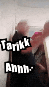 a blurry picture of a person with the words " tarikk ahhh " on it