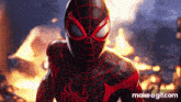 a close up of a spider man in front of a fire .