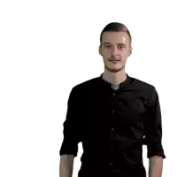 a man in a black shirt is reaching out his hand