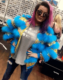 a woman wearing sunglasses and a t-shirt that says hippie on tour