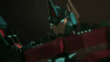 a close up of a transformer robot with blue eyes and a red sword .
