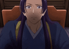 a man with purple hair is sitting in a chair with his eyes closed