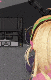 a girl with blonde hair wearing headphones and a pink top