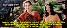 two women standing next to each other with a caption that says " look at her she 's "