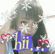 a girl is surrounded by snowflakes and the words hii