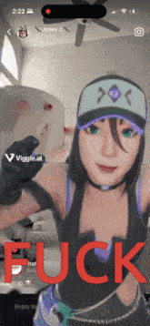 a phone screen shows a girl with a hat and the word fuck