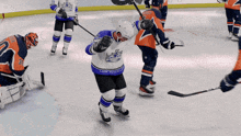 a hockey player wearing a jersey that says los angeles on it