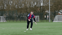 a man in a red and blue jersey with the number 10 on it