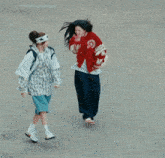 a girl wearing a red jacket with the word supreme on the sleeves