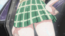 a girl in a green and white plaid skirt is standing in a car