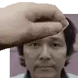 a hand is touching a man 's forehead in a pixel art .