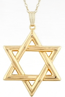 a gold star shaped pendant is on a chain
