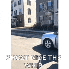 a ghost is riding a whip down a street next to a building .