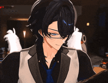 a man with long black hair and glasses is standing in a dark room