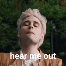 a man with his eyes closed has the words hear me out written on his face