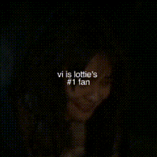 a blurred image of a person with the words vi is lottie 's # 1 fan above them